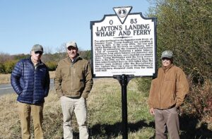 From left, Essex County Countryside Alliance President Peter Bance, Essex County Countryside Alliance Board member Sam Sturt, and Essex County North Election District Supervisor Sidney N. Johnson pose at a historical marker recognizing the contributions of Layton’s Landing Wharf and Ferry.