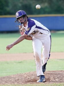 The Trojans’ Aiden McGirt delivers a pitch against Franklin.