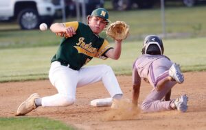 Essex’s Jay Jeter slides head-first into second base on a steal attempt as Northumberland shortstop Chase Hymes prepares to catch the throw from home plate.