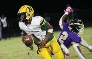 Northumberland QB Tyreek Lundy scampers away from Essex defender Jaden Holmes en route to some of his 424 yards total offense.