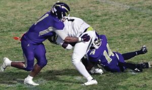 Essex’s Zay Bundy (1) and Jodece Cox combine to bring down Northumberland’s Cincere Gibson in the Indians’ backfield following a pass reception.