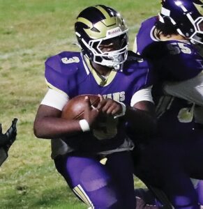 The Trojans’ Demetrius “Toot” Stewart locates an opening in the Northumberland defense. Stewart rushed for 87 yards, a touchdowns and four two-point-conversions in Essex’s 40-14 playoff win.