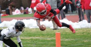 Rappahannock’s C.J. Kelly stretches for the pylon after being upended by Buffalo Gap’s Jordan Martin during Saturday’s state semfiinal contest.