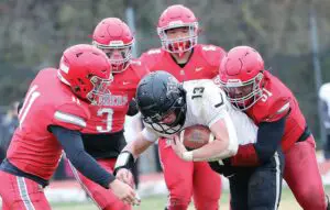 A mass of Rappahannock defenders descend upon Buffalo Gap ball carrier Cooper Reed. From left, Samuel Kelly, Chase Self, Carter Sullivan, and Tanner Cook.