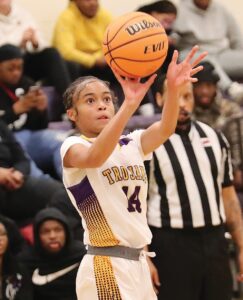 Lady Trojan Isabella Anderson launches a shot from the baseline during Essex’s season-opening win over West Point.